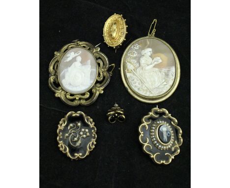 Two circa 1900 shell cameo brooches, two black enamel and seed pearl dedcorated mourning brooches and a gold coloured oval br