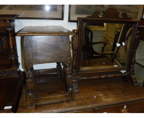 An oak lift-top box with carved and turned legs and stretchered base, an oak framed dressing table mirror, mahogany and satin