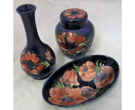 A W Moorcroft "Pansy" pattern oval dish, onion-shaped vase and ginger jar and cover   CONDITION REPORTS  Dish - has some roug