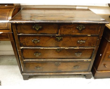 An 18th Century walnut chest of two short over three long graduated drawers to bracket feet