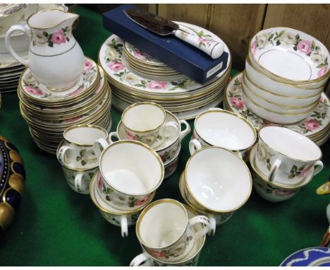 A Royal Worcester bone china "Royal Garden" pattern rose decorated dinner/tea service