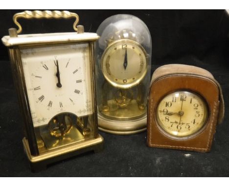 An Art Deco copper cased travel alarm clock, the circular dial with Arabic numerals, housed in a leather carry case, together