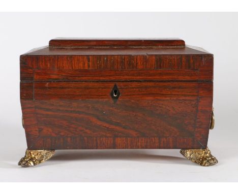 Regency rosewood tea caddy, of sarcophagus form with loop handles, the hinged lid opening to reveal two lidded compartments a