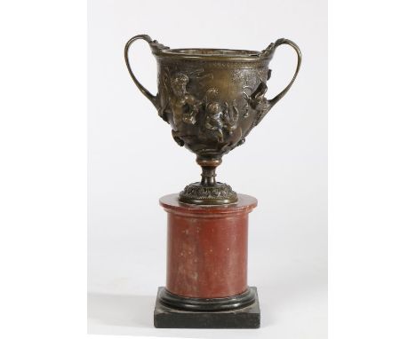 19th Century Grand Tour bronze vase, the body with raised fawn and cherub decoration flanked by foliate and birds head cast h