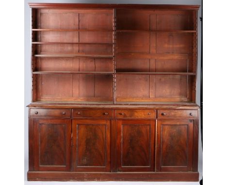 Victorian mahogany open bookcase cabinet, the concave cornice above adjustable shelves and a base section with four short dra