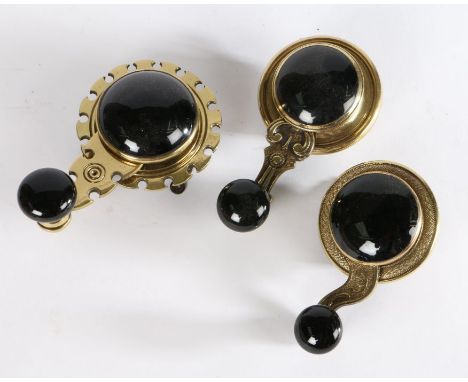 Three Victorian internal brass and black ceramic Victorian servants’ bell pulls / cranks (3)