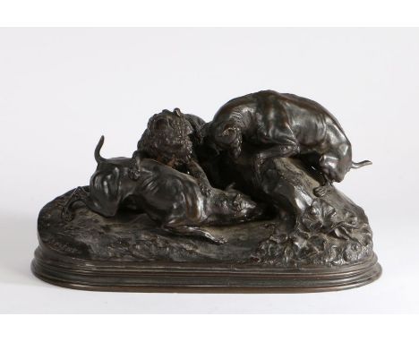 After Pierre Jules Mene, bronze, Three dogs at the fox hole, signed P J Mene, 38cm wide, 21cm high