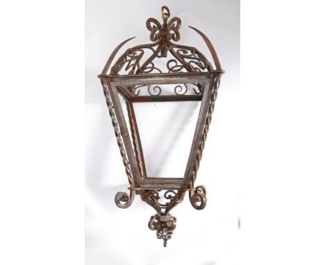 Iron lantern, the scrolled top above a domed scroll and spiked top section, tapering central section with twisted corner moun