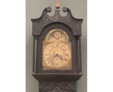 LATE 18TH / EARLY 19TH CENTURY OAK LONGCASE CLOCK, ebonised and heavily carved case, brass dial with rolling moon, marked 'Sh