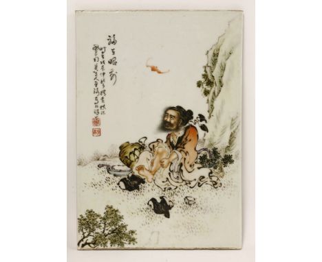 A Chinese ceramic panel, painted with a Daoist immortal resting by a cliff, massaging his leg with his shoes off, a bat in re