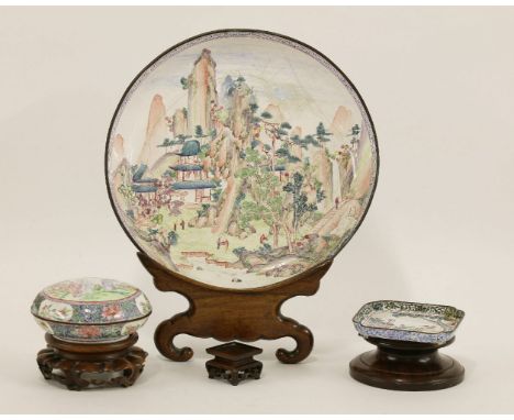 A Chinese Canton enamelled plate, Qianlong or later, of circular form, painted with figures amongst a mountainous landscape, 
