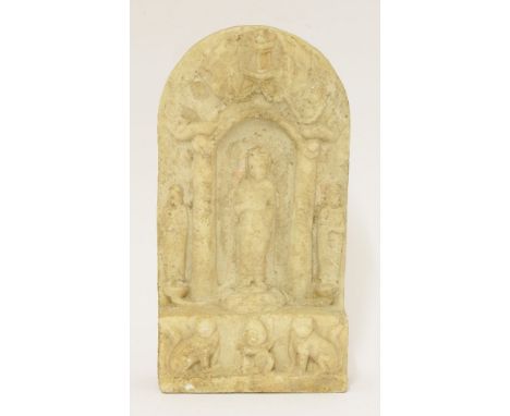 A Chinese marble Buddhist panel, in the Northern Qi style and probably of the period, the centre carved with Guanyin standing