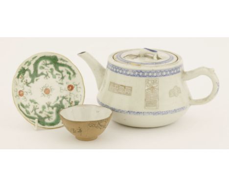 A Chinese blue and white teapot and cover, c.1900, the body with seal patterns between diaper and key fret borders, 11cm high