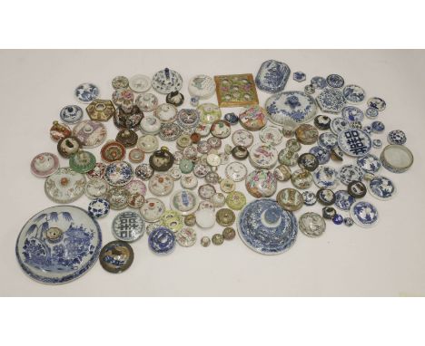 A collection of ceramic lids, 18th century and later, including blue and white, Canton and famille rose examples, almost all 