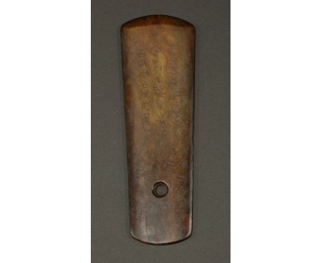 A Chinese jade gui,probably early 20th century, in the Zhou dynasty style, carved in the shape of an axe, with a hole to lowe