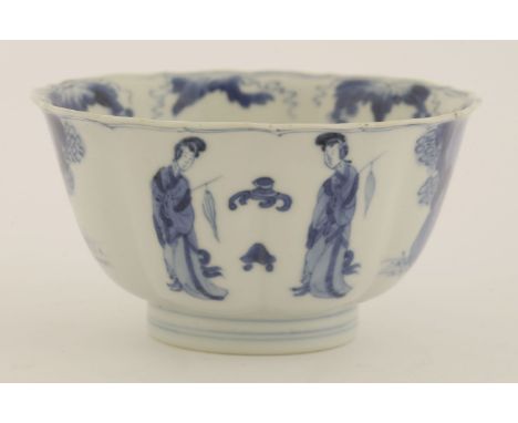 A Chinese blue and white bowl,Kangxi (1662-1722), of circular lobed form with slightly flared mouth, painted with scholars an