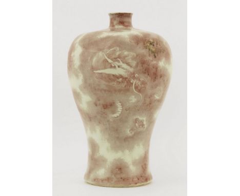 A Chinese meiping,18th/19th century, painted in underglaze copper-red with a dragon dimly seen through the clouds, six charac