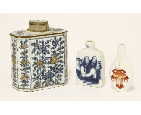 A Chinese blue and white tea caddy, 18th century, with blossoming branches coming out from rocks, gilt detail, 10cm, and two 