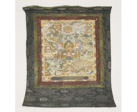 A Tibetan thanka, 20th century, painted in bright colours with Buddha seated in a lotus pedestal in the centre, surrounded by