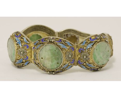 A Chinese silver gilt hinged bracelet,1930s, the mesh ground enamelled with scrolling flowers inset with jade roundels, stamp