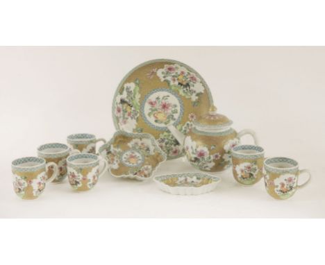 A collection of famille rose teawares,Yongzheng (1723-1735), comprising:a teapot, cover and tray,six coffee cups,a spoon tray