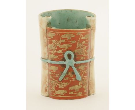 A Chinese faux-marble enamelled porcelain brush pot,Qianlong (1736-1795), in the shape of two partially unrolled scrolls of d