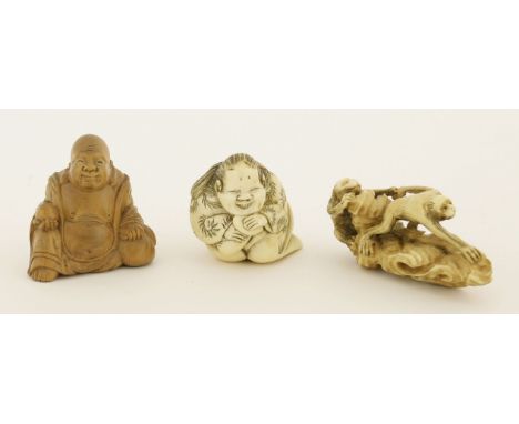 A collection of three Japanese netsuke,Meiji period (1868-1912), one carved in ivory of an ape helping another to reach, prob