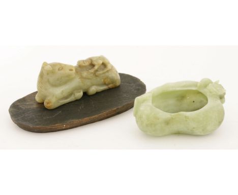 A jade carving, with a monkey on the back of a recumbent horse, 8cm, associated wood stand, and an hardstone brush washer, in