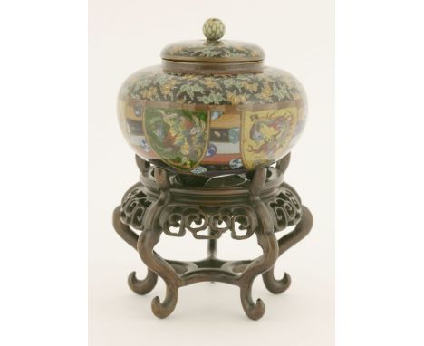 A Japanese cloisonné jar and cover,Meiji period (1868-1912), the squat body enamelled with a dragon and ho-o in shield-shaped