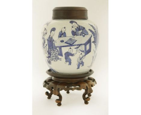 A Chinese blue and white jar,late Qing dynasty, painted with ladies playing with boys in a garden,21cm, wood cover and stand 