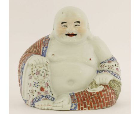 A Chinese famille rose Budai,Republic (1912-1949), his garment painted with brickwork and florets with scroll borders, impres