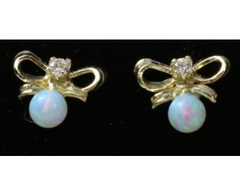 Pair of opal gold-plated bow ear-rings   Condition Report   Click here for further images, condition, auction times & deliver