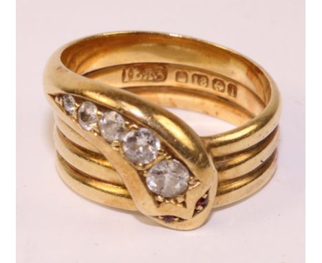 18ct gold ring in the form of a diamond set coiled serpent with ruby eyes Birmingham 1908 approx 10.5gm   Condition Report   