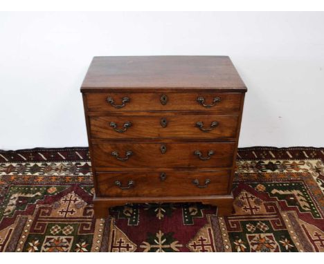 A George III small mahogany tea caddy chest of drawers, four graduated drawers PLEASE SEE ADDITIONAL IMAGES. IT MEASURES 76CM