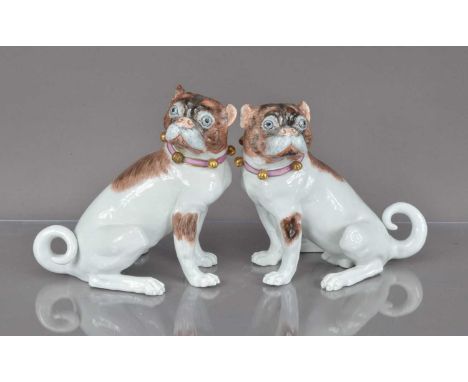 A pair of 20th century Dresden porcelain dogs, one with repair to tail, 18cm high, modelled as seated bull dogs (2) PLEASE SE