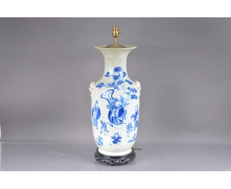 An early 20th century Chinese blue and white porcelain vase now converted to a lamp base, vase damaged and restored and 55cm 