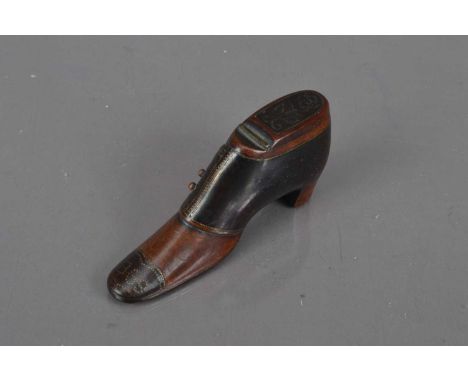 A 19th century boot shaped treen snuff box, pique work, dated 1869 to toe, 10cm long