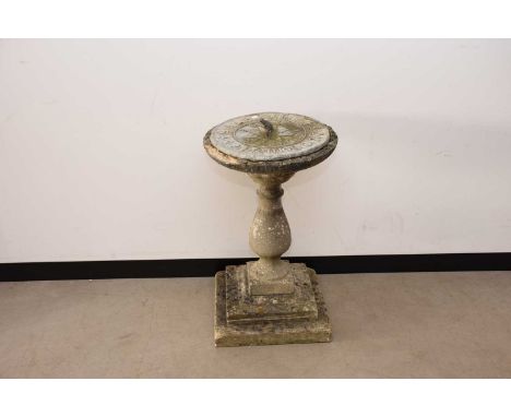 A second half 20th century concrete and lead sundial, AF, the dial is 43cm diameter, base in three sections and damaged to up