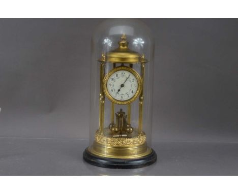 A German gilt brass "400 Day" Anniversary Clock circa 1920, customary temple form with six column supports. White enamel dial