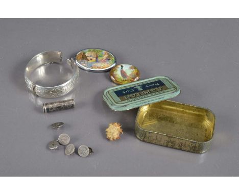 A silver bracelet and a tin containing various silver items etc, the bracelet Birmingham 1961, the other items including an A