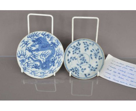 Two small Chinese porcelain blue and white dishes, one café au lait style, probably 18th century, the other with dragon to fr