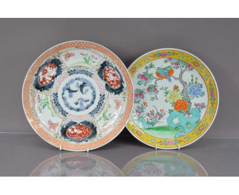 Two Chinese porcelain chargers, one underglaze blue with polychrome over glaze decoration, 33cm, the other in bright colours 