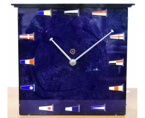 Late 20th century wall clock in blue perspex with enamelled flags, fusee movement, 33cm wide and 32cm high. 