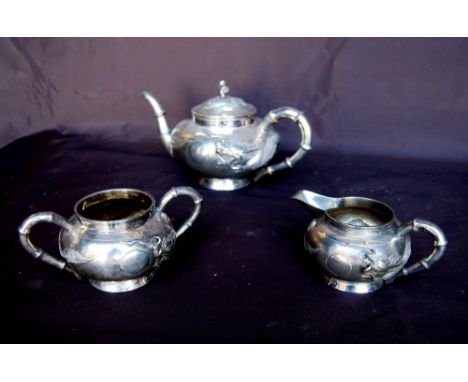 Wo Sing Lung, Shanghai, Chinese silver three-piece tea set, 30oz, c. 1920s.CONDITION REPORT: This is in good overall conditio