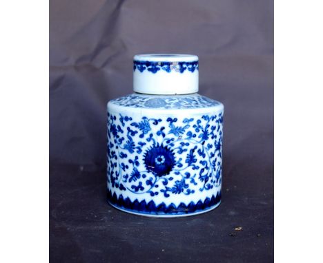 Chinese 18th century blue and white tea bottle of circular section decorated with trailing flowers, 12.5cm high.CONDITION REP