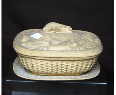 19th century ivory coloured earthenware game tureen on stand, of naturalistic basket form, the cover with a crouching hare am