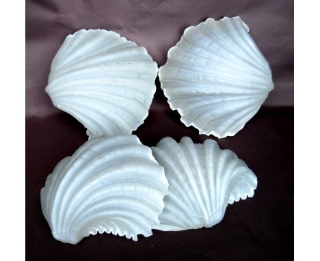 Set of four opaque glass scallop form wall light shades, 24cm wide.CONDITION REPORT: Has some small inclusions.  Some chips t
