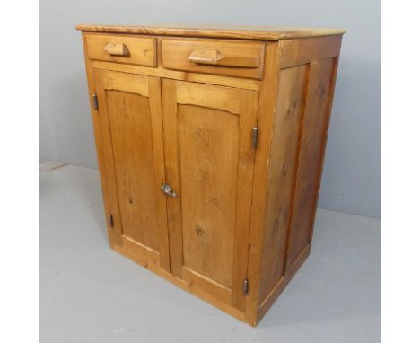 An antique pine larder cupboard, with two drawers over two panelled doors and shelf fitted interior. Width 89cm, height 109cm