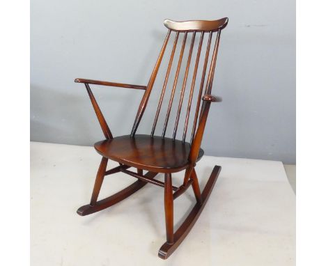 ERCOL - A mid-century stick back rocking chair.