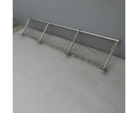 A vintage tubular aluminium luggage rack with original netting, from a British Rail mk.1 carriage. Length 177.5cm, depth 40cm